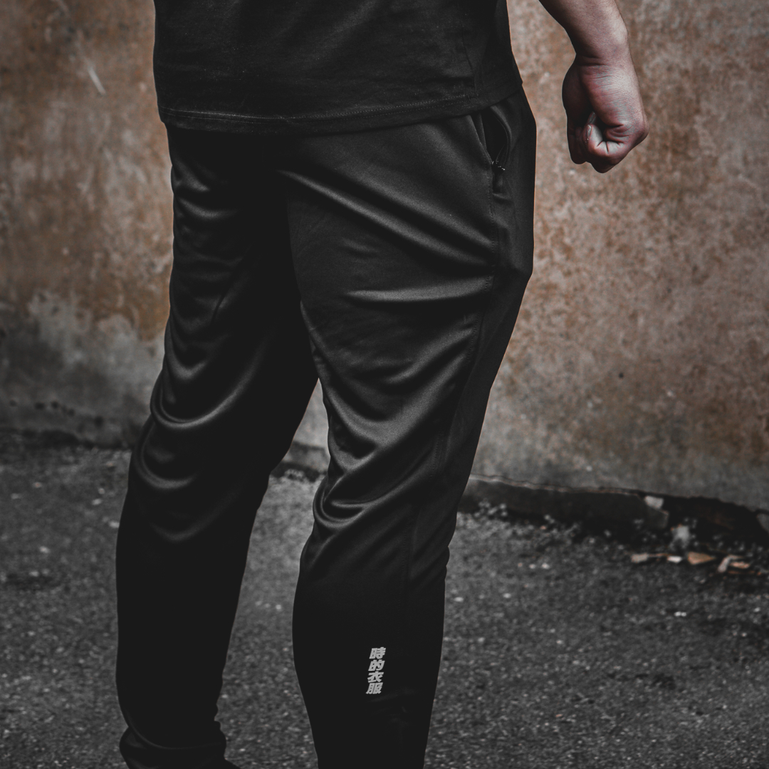AM Logo Trackies